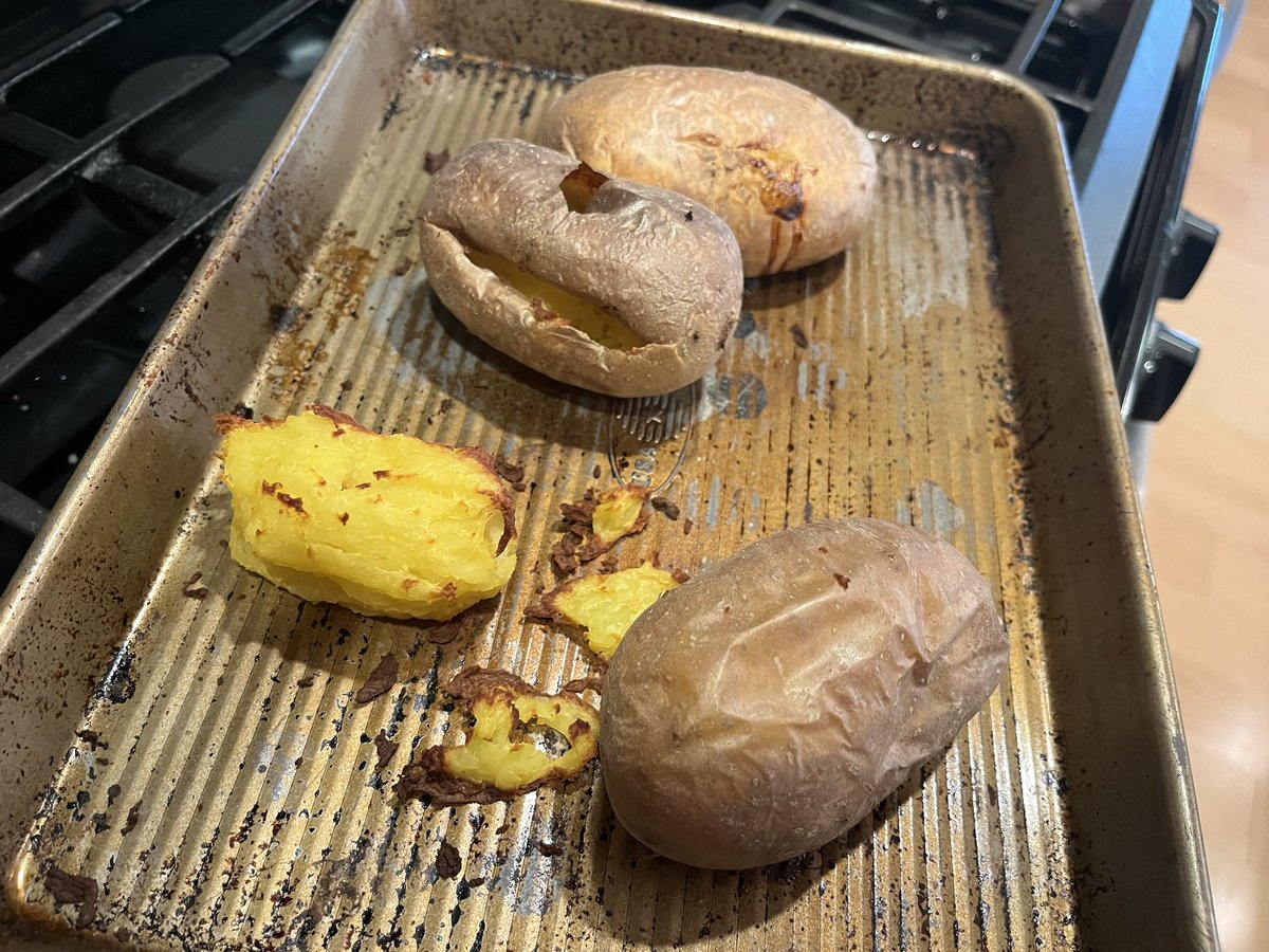 carolpopegordon's tweet photo. I forgot to stab the potatoes before baking and one of them exploded out of the skin. 😬#bakingdisaster https://t.co/l0pbJmq3Cs