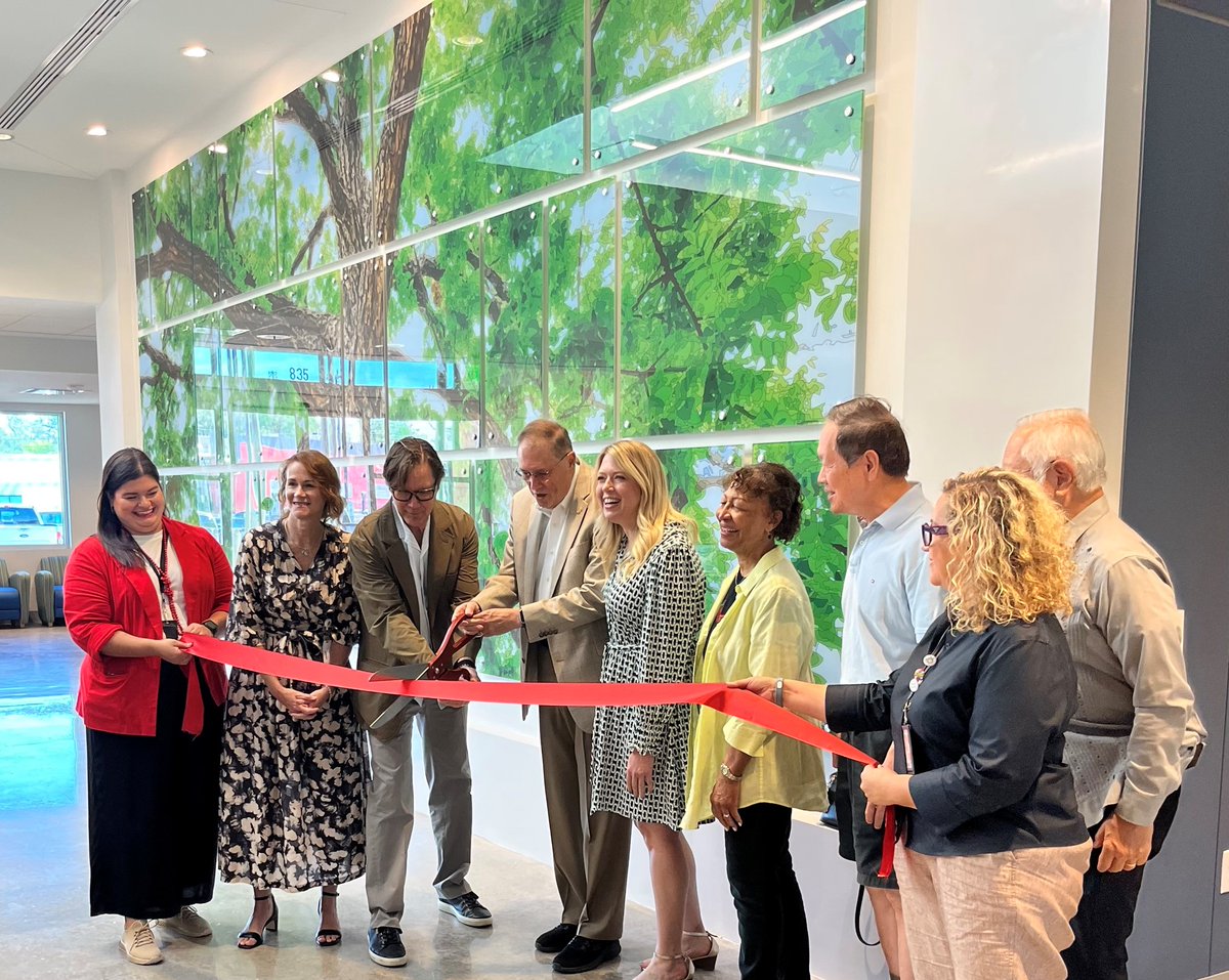 This morning we officially cut the ribbon on 'Canopy for Dreams San Antonio' in the Walker Ranch Senior Center in Council District 9! Artist Stephen Galloway was on hand to help with the oversized scissors. #GetCreativeSA #PublicArt #SeniorCenter #Nature #Art