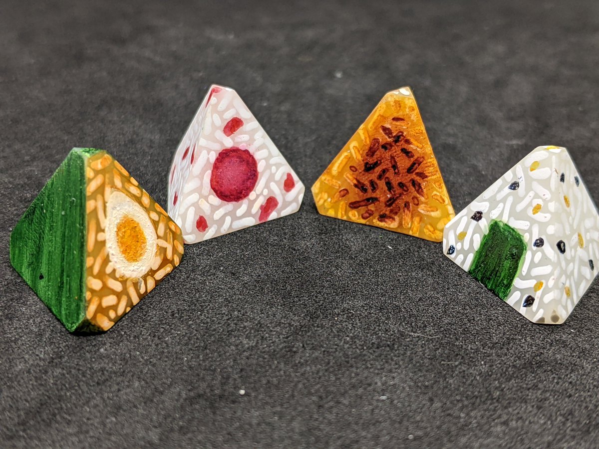 New dice designs 👀

Working on an onigiri D4 set for the next sushi dice release while I finish up current orders. 

Gonna put the shells on these tonight.

#dice #dicecraft #diceset #dnd #ttrpg #ttrpgdice #polyhedraldice #homebrewdice  #handmade #smallbusiness #onigiri #sushi