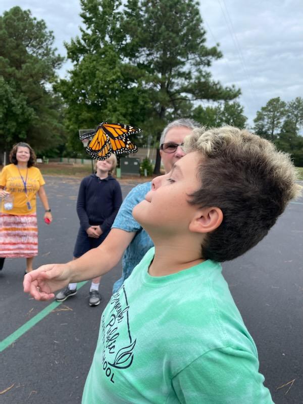 6th grade, with the help of Mrs. Clapp's class, released a monarch butterfly that emerged from her chrysalis. The 6th graders decided to name her Dorothy.
