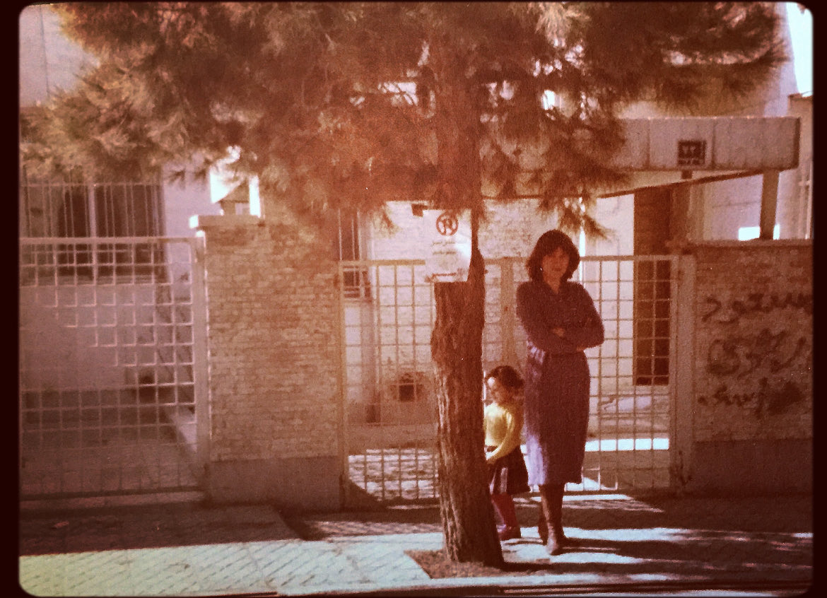 JosephiAdele's tweet photo. Jag och min mamma i Teheran under islamska revolutionen. Sista dagarna innan slöjtvånget. Klottret på väggen: Masoud Rajavi (Folket Mujahedins ledare). Min mamma var inte glad när bilden togs och hon blev inte glad igen på väldig många år. https://t.co/IHBV9qT8tr