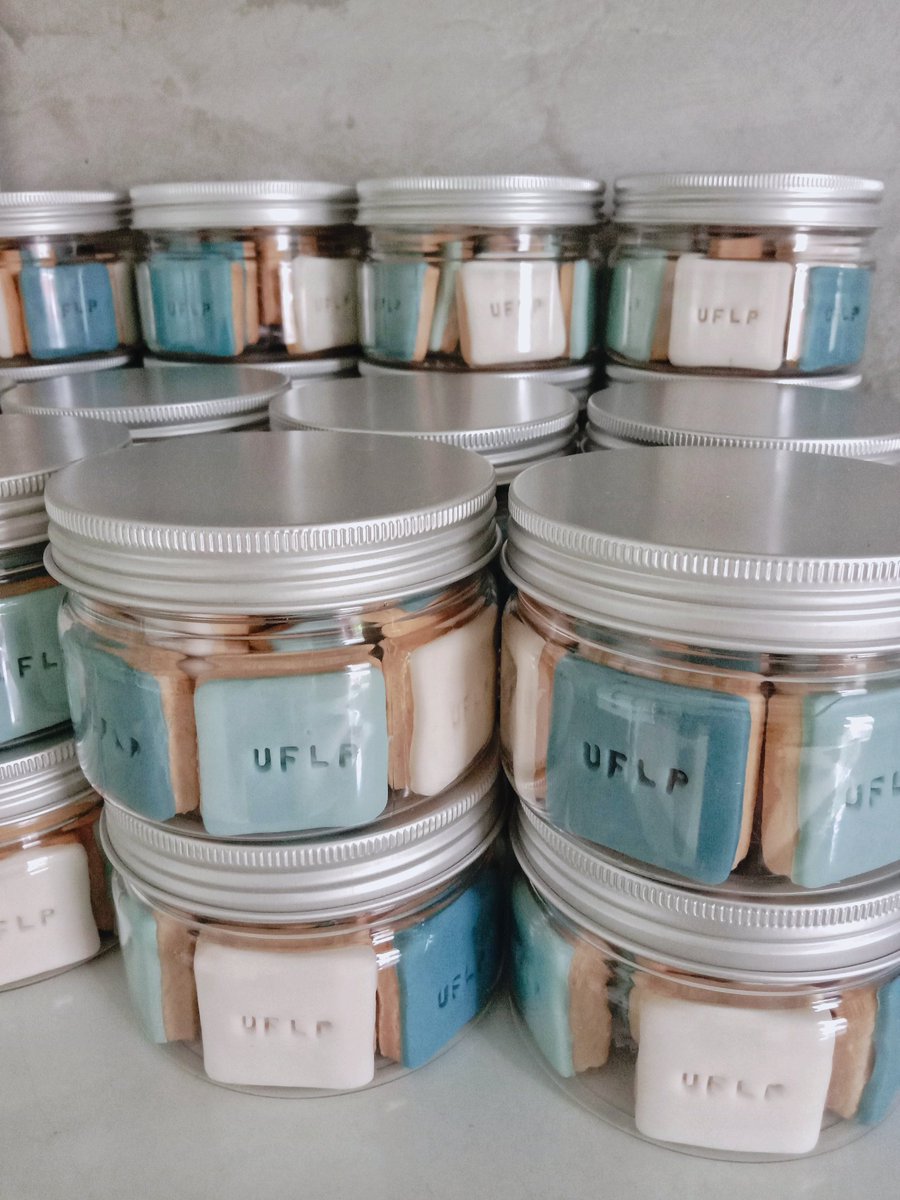 s_kiv13's tweet photo. custom gift request for some company event #nomention minis square vanilla cookies with fondant icing UFLP stamp on top 💙 #bakingdaily #icingcookies https://t.co/VXrQ5oe0MJ