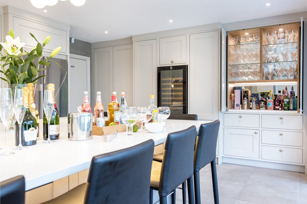 The kitchen is the centre of the home, and for this kitchen it is the perfect entertaining space. The glass shelves and pivot doors for the ‘bar’ make this a display feature when in use… the wine cooler is a perfect focal feature too.