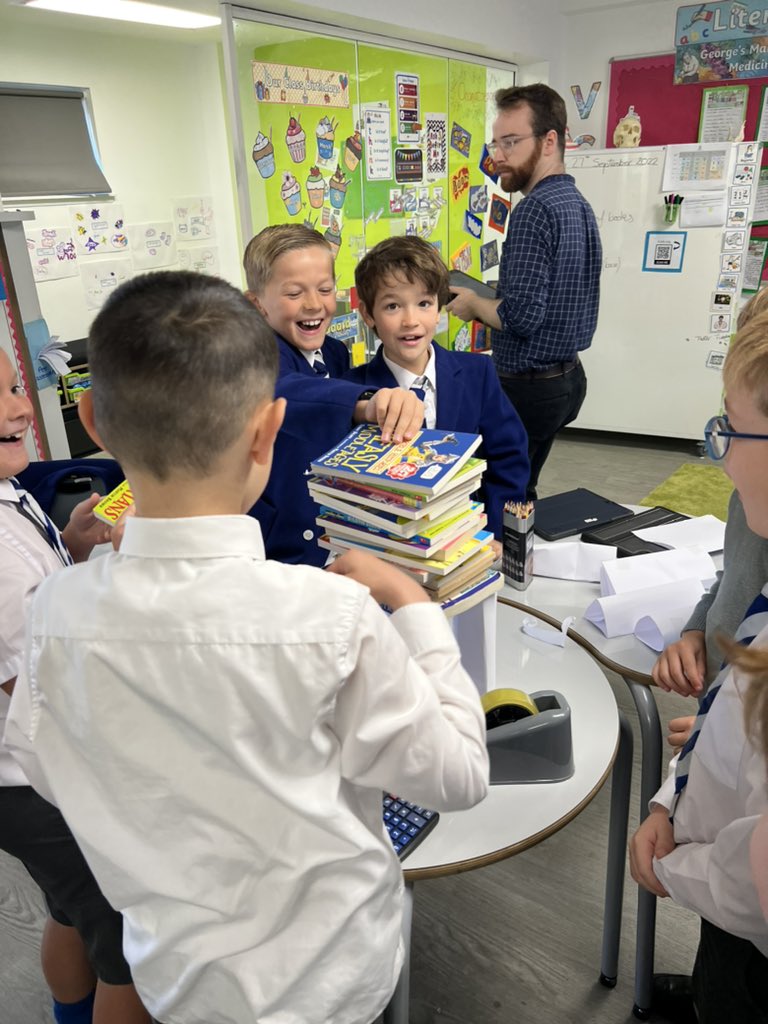 Kelvinside1878's tweet photo. To start off #MathsWeekScot J5 created triangular structures out of paper to see how many books they could balance. The record number of books was 20 and they made sure all the paper was recycled as part of #ClimateActionWeek ! #KAJ5 #KAJuniors #KAMaths @KA_Science https://t.co/s9PuesSkWO