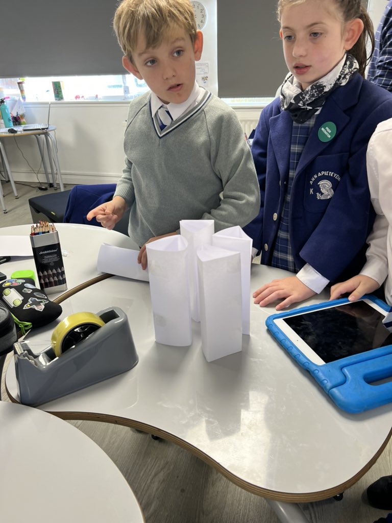 Kelvinside1878's tweet photo. To start off #MathsWeekScot J5 created triangular structures out of paper to see how many books they could balance. The record number of books was 20 and they made sure all the paper was recycled as part of #ClimateActionWeek ! #KAJ5 #KAJuniors #KAMaths @KA_Science https://t.co/s9PuesSkWO