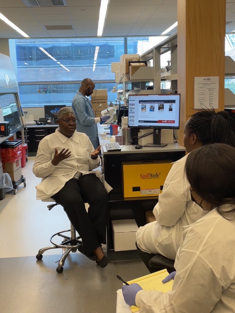 DCDFS's tweet photo. Dr. Jocelyn Hauser, Interim Public Health Lab Director, instructing @HowardU clinical lab students and @DCDFS staff during their Clinical Microbiology Practicum. #publichealthlab https://t.co/eZSCeTo1X8