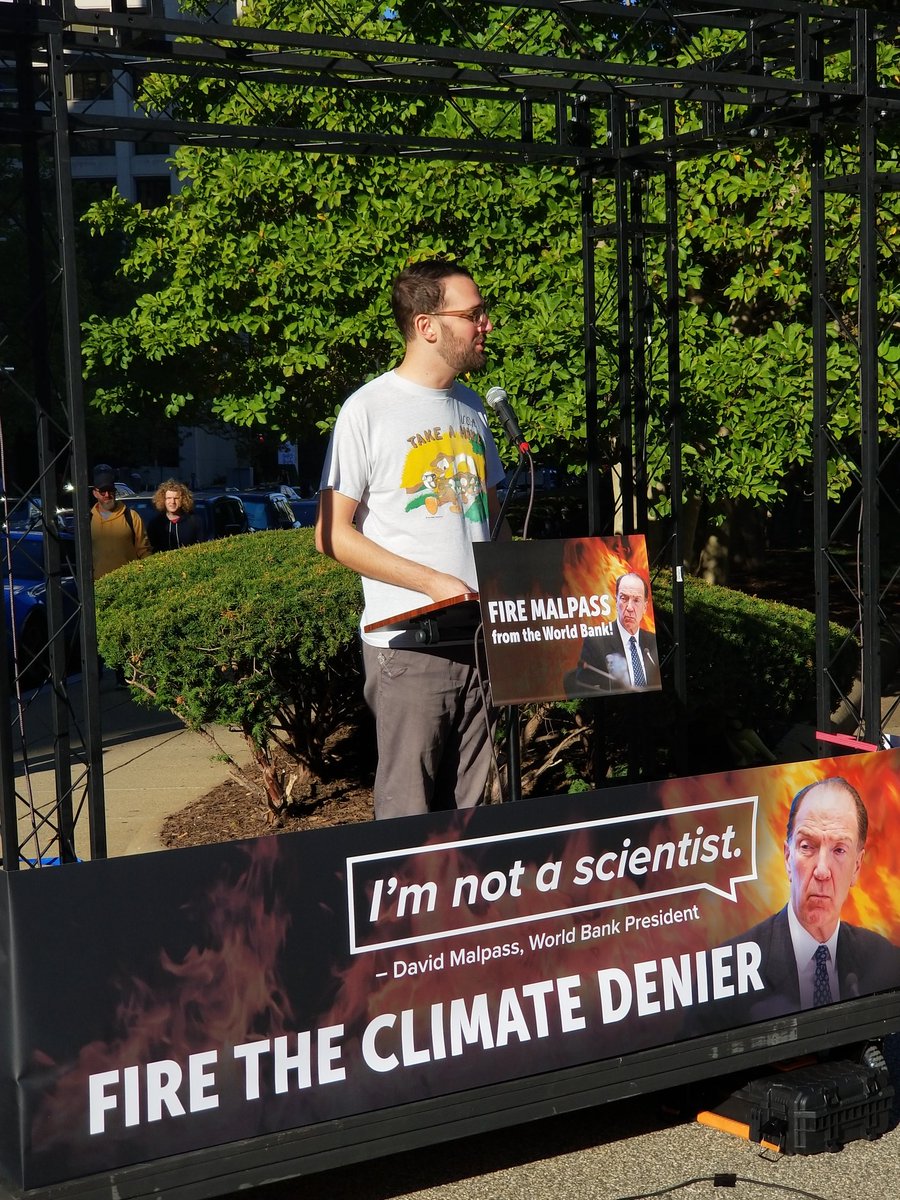 Truly inspired protest outside the World Bank. Since its president says he's not a scientist, scientists are reading peer-reviewed science outside his door all morning!