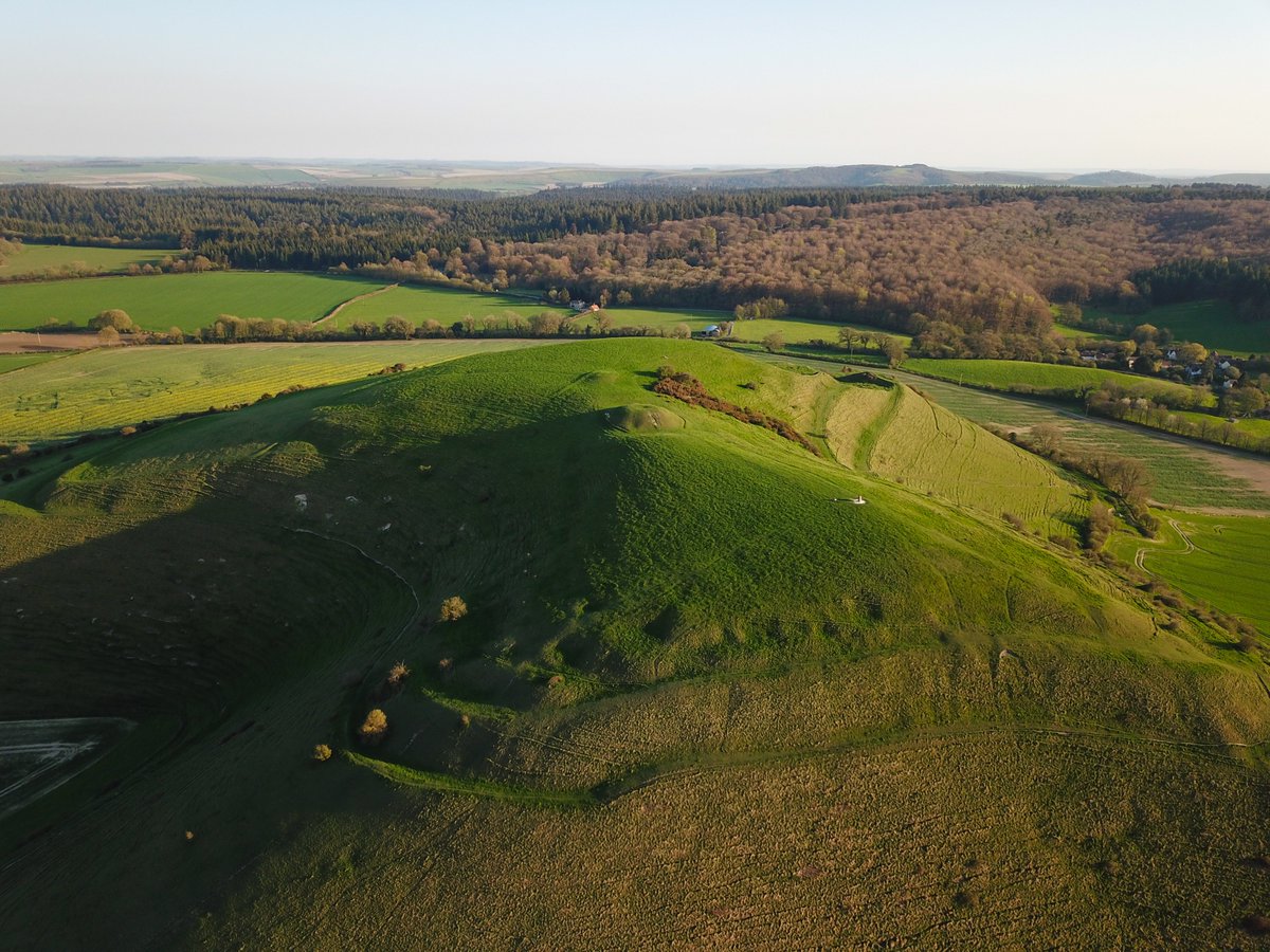 Glyndle's tweet photo. Cley Hill near Warminster in Wiltshire. A very distinctive local landmark which has a bit of everything - Iron Age hillfort, Bronze Age bowl barrows, medieval strip lynchets and stupendous views from the top. A local legend suggests it was formed by the devil ! I'm not so sure... https://t.co/ZRkyHc7afh