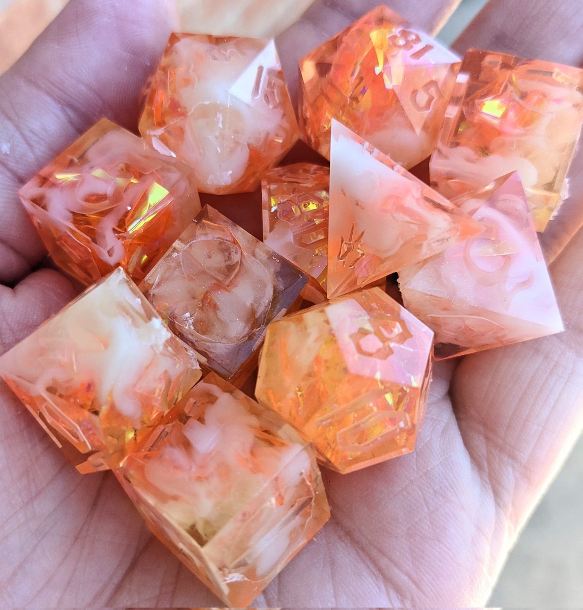 HellhoundDice's tweet photo. My FIRST set of dice using my custom masters has exited the pressure pot! 😍 I promised my bf the first set I made, and modeled them after the cover art of his favorite video game. These are raw and unsanded. Couldn't ask for a better outcome ❤️🥰

#dice #resin #dicemaking https://t.co/AlqKe9ZudM