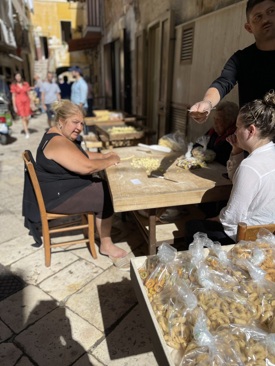 jenpelka's tweet photo. My new retirement plan is to move to this alley in Bari to become a pasta nonna and hand-make orichette and gossip with my gals all day. Who’s with me!? https://t.co/doMtzlg1IW