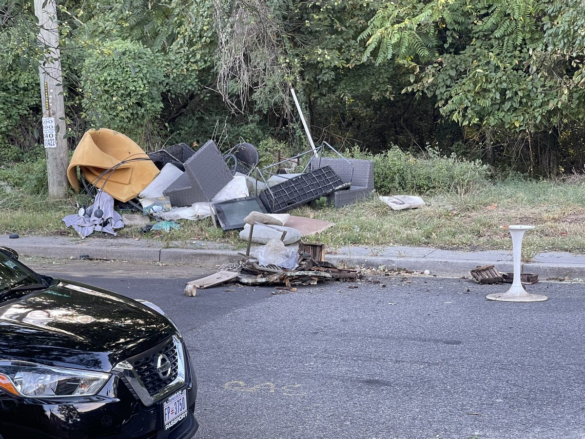 shyshowbob_'s tweet photo. @ANC7F we have an illegal dumping situation on Benning Ridge. Someone came in a Budget van and dumped all of this trash into the street and sidewalk. https://t.co/P2KV7JMpoc