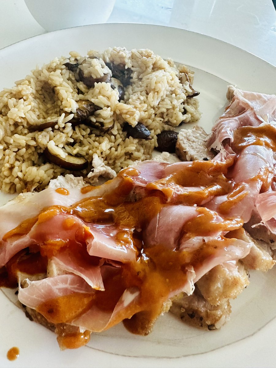 eatsbyparker's tweet photo. air fried pork chops breaded with crushed pork rinds and black pepper. topped with prosciutto, mustard based bbq and honey drizzle. mushroom and garlic rice simmered in beef bone broth. https://t.co/iYL534vYao