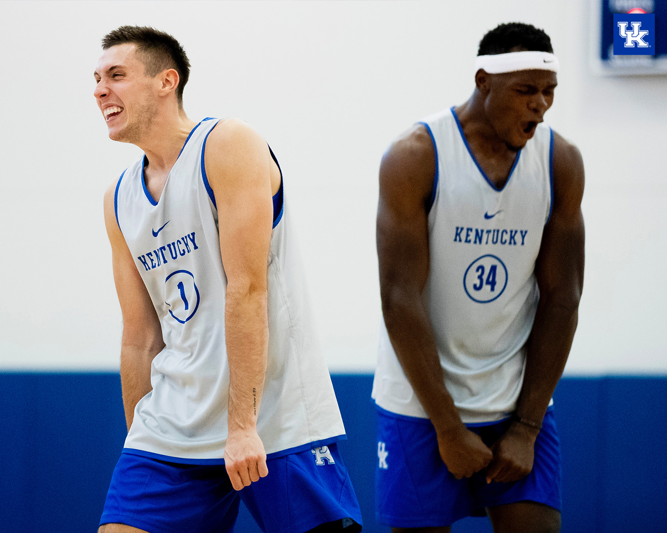 CJ Fredrick and Oscar Tshiebwe yell in excitement during practice