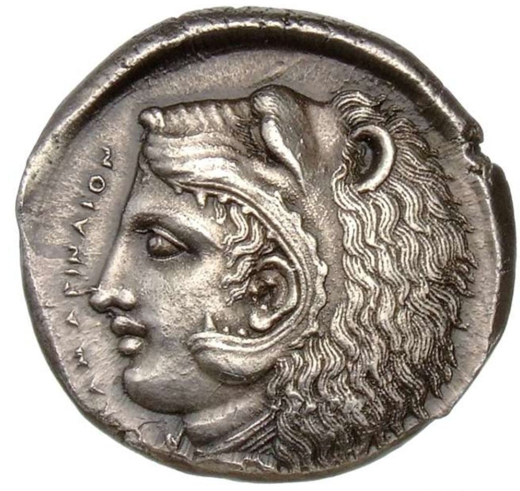 Fantastic Greek coin from ancient Greek city of Kamarina, in Sicily, Italy. Front side: Athena drives a quadriga as Nike crowns her from above. Inscribed is the name ΕΧΑΚΕΣΤΙΔΑΣ. Reverse side: a young Herakles wears the Nemean lion skin. Inscribed is ΚΑΜΑΡΙΝΑΙΟΝ (of Kamarina)