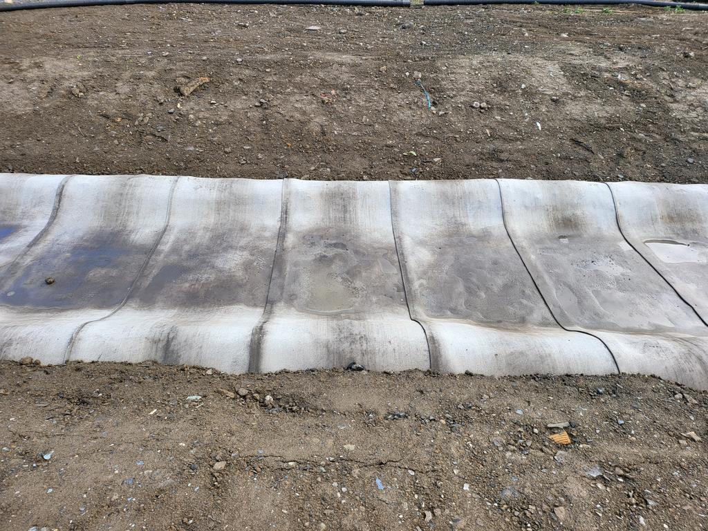Concrete apron to new stream being installed on site.