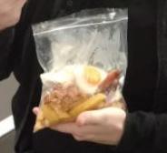 ladbible's tweet photo. This lad's flight got called to the gate so he tucked away his Wetherspoon's breakfast into a clear plastic bag 😂😂 https://t.co/4OpG1T56d9
