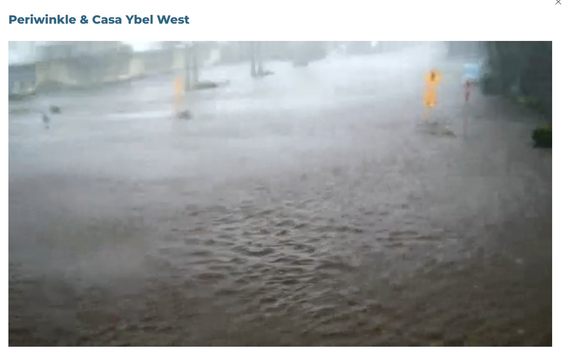The water is coming in FAST in Sanibel, where Ian's eye wall is moving inland. What this street normally looks like, and what Ian has already done, via the city's traffic cameras.