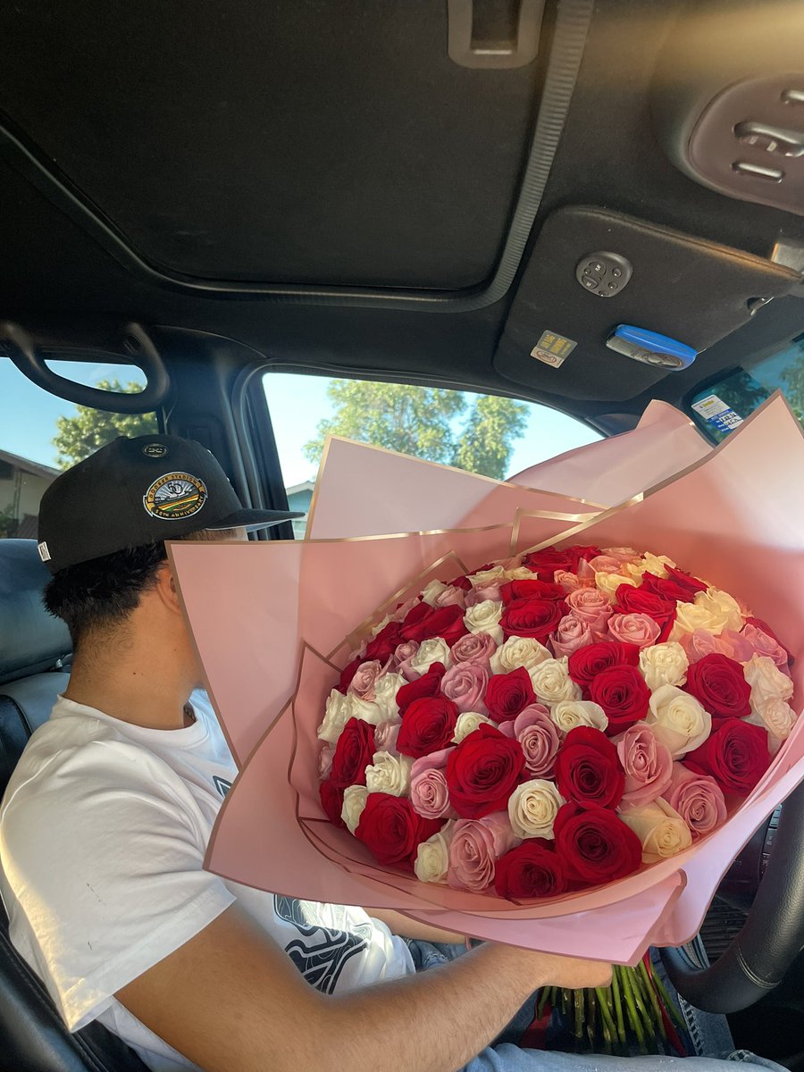 by her flowers >>