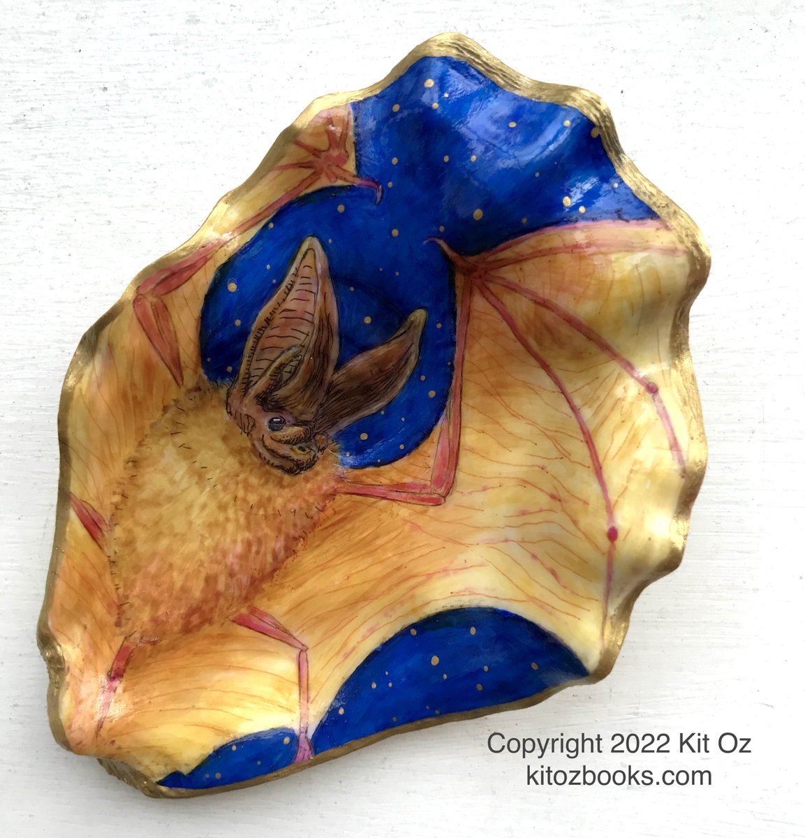 KitKitOz's tweet photo. Townsend's Big-Eared Bat.... on an oyster shell. Soon to be for sale in the shop at 
@iheartSAM

#halloween #bat #oyster #shell #shellart #porcelainpainting #wildlife #pnw #gothic #creepy #wildlifeart #seattleartist #seattle #illustration #vampire #blue #gold #handdrawn https://t.co/D2AT11P2wM