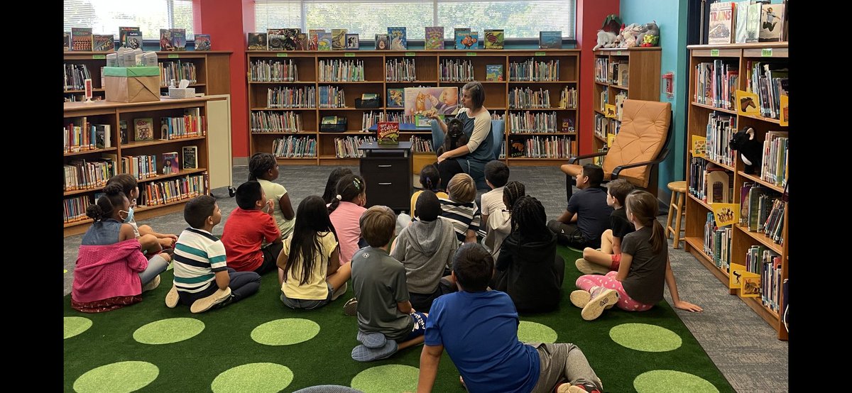 Reading about Dewey the library cat with #hattiethelibrarydog sitting on my lap 🐾 📚 ♥️ #dentonisdlib <a href="/dentonisd/">Denton ISD</a>