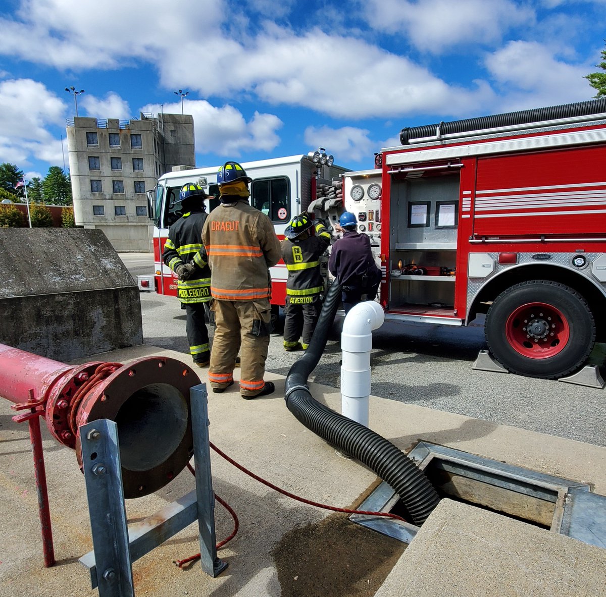 MassDFS's tweet photo. #FirefighterTraining: Earlier this week, members of Massachusetts Firefighting Academy Career Recruit #Class305 learned and practiced drafting operations, where a pump draws water from a static source -- in this case, the drafting pit at our Stow campus. https://t.co/1yxf3w3Hnr