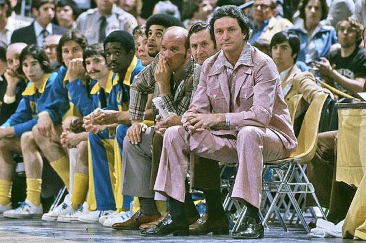 Super70sSports's tweet image. John Wooden won 10 NCAA titles. Al McGuire won one wearing a pink leisure suit. I'm calling it a tie.