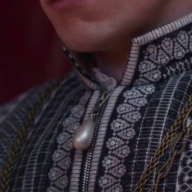 unironically obsessed with the costuming decision to renaissance up a zipper by dangling a big pearl from it