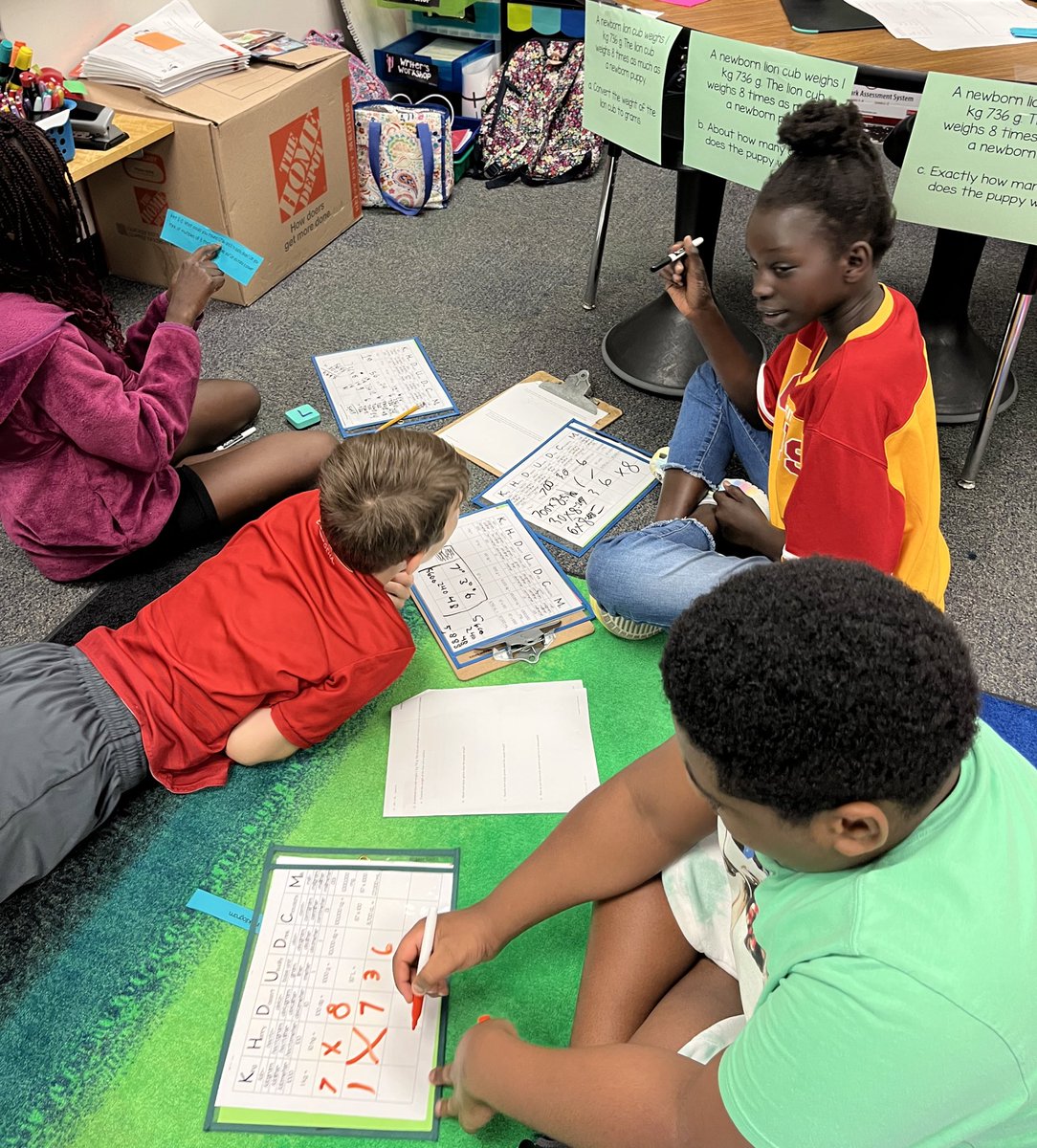 Fifth grade mathematicians collaborating and communicating to solve multi-step word problems. As a team they had to decide when or if they were ready for a “hint” card and then problem solve on their next steps! I am so proud of their engagement and hard work! <a href="/ToppingBulldogs/">Topping Elementary</a>