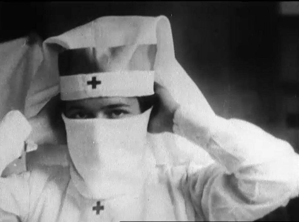 A Red Cross Nurse Demonstrates how to put on a Mask during the Spanish Flu Pandemic, Boston, 1918
#RedCross #Nurse #SpanishFlu #Pandemic #Boston #c1918