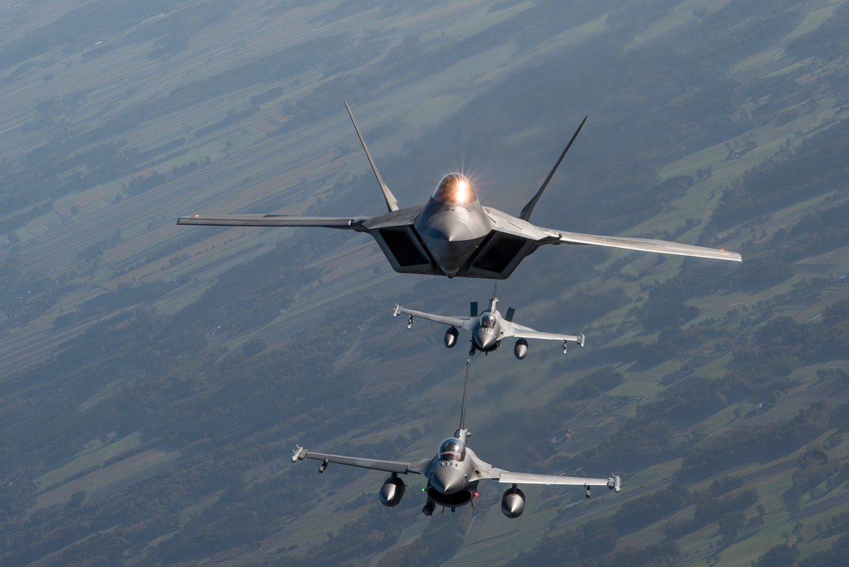 USAF F-22s from the 90th Fighter Squadron, 3rd Wing operate with Polish F-16s near the 32nd Tactical Air Base, Łask, Poland.