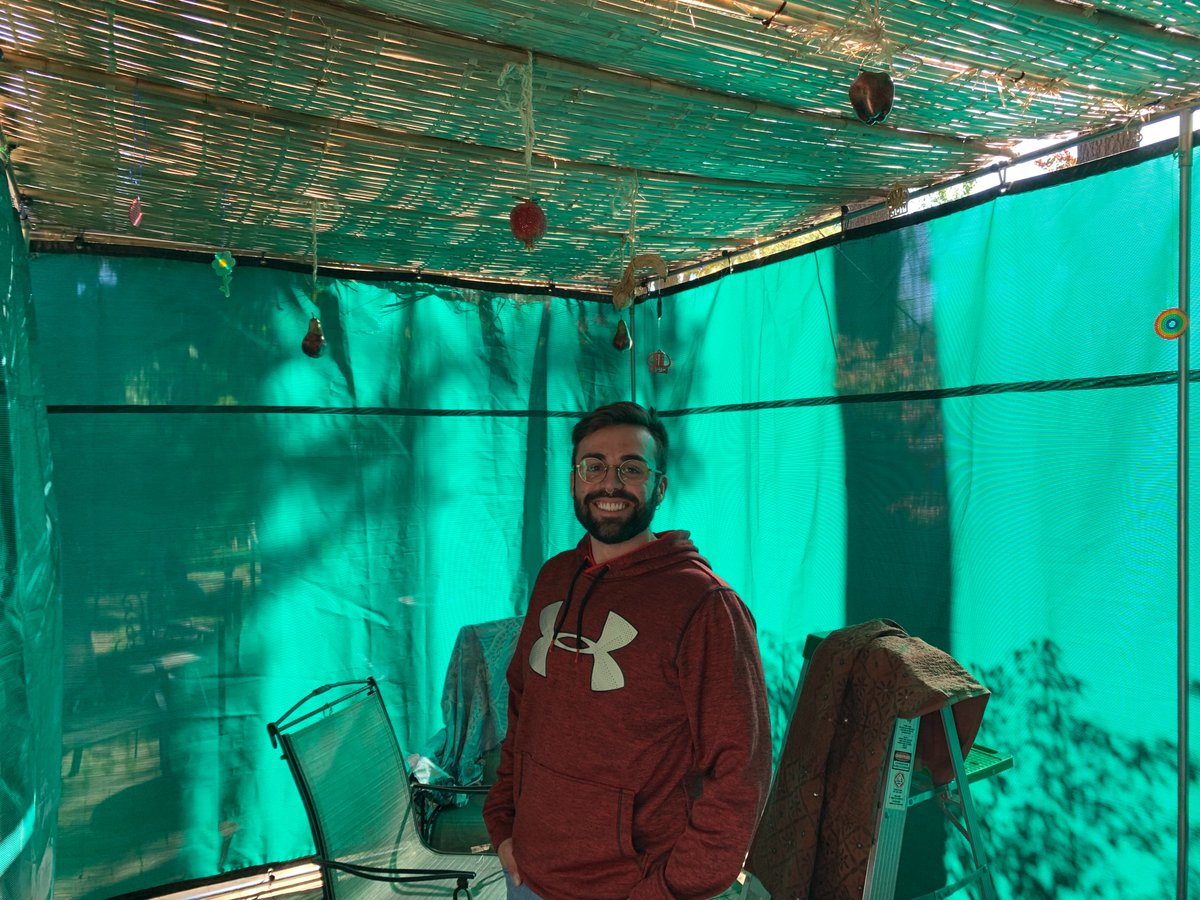 MillerCenterHC's tweet image. An afternoon of interfaith sukkah-building: Kyle Desrosiers, a Master of Divinity student at @bcstm and a Miller Center staff member, joined Hebrew College rabbinical student Rafi Ellenson at Rabbi Or Rose's house to build the sukkah for the Jewish harvest festival.