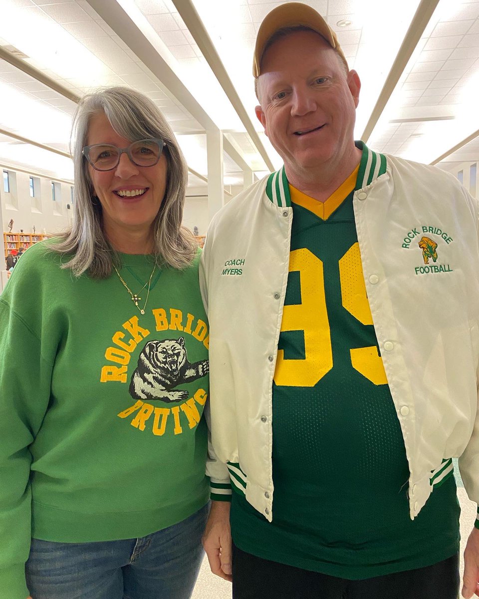 L2Holt's tweet photo. Jon Myers and I going “old school” for Through the Decades Day for Homecoming.  The jacket is from 1992 and the sweatshirt late 80s.  Jon with the pics from way back when!  @NobulMyers https://t.co/FPVCIZTgdt