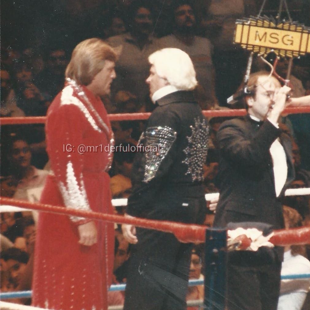 A candid photo of Paul Orndorff & #bobbyheenan plotting someone's destruction as #howardfinkel rocks the mic.