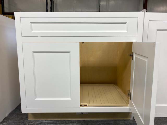 BrightonCabinet's tweet photo. Did you know we can also add accessories to our cabinets? This is a sink base with drip tray installed. It has a unique design that funnels excessive water to the front of the cabinet and onto the floor as an alert to a leak. #brightoncaninetry #cabinets #sinkbase #driptray https://t.co/SZI5ys9DS8