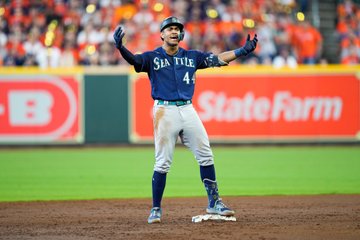 Julio Rodríguez celebrates at second base. 