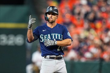 Adam Frazier celebrating at second base. 