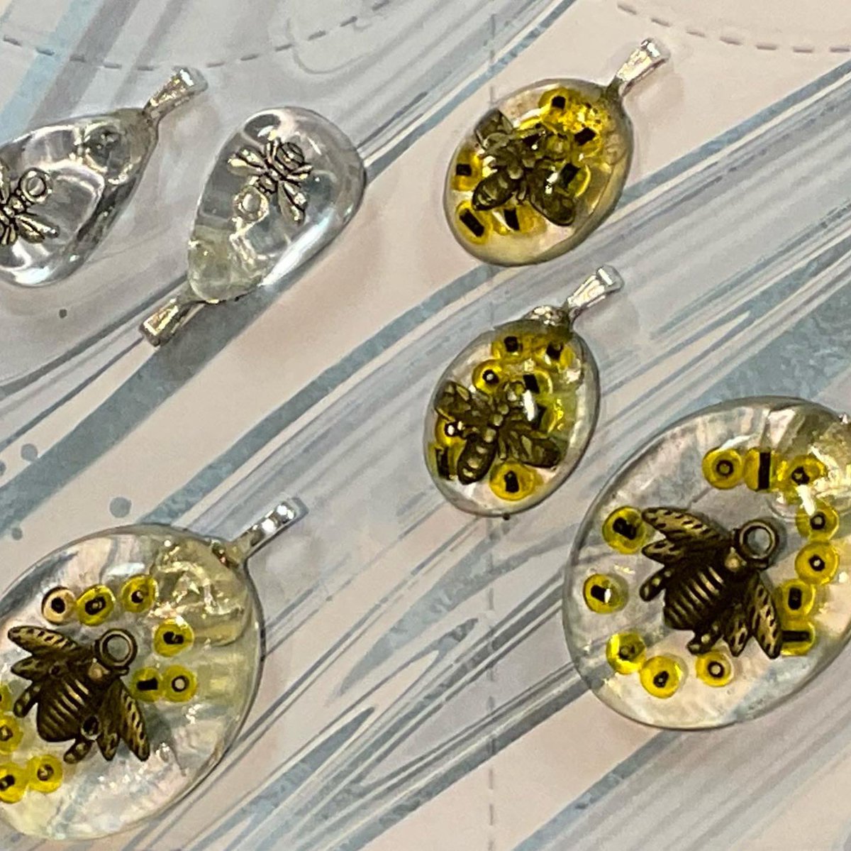 carolinecoates's tweet photo. Just some of the amazing pieces created at tonight's resin jewellery workshop at @firedpaintapot 
Join us next month for intro to calligraphy https://t.co/2kxdpcKVQ3