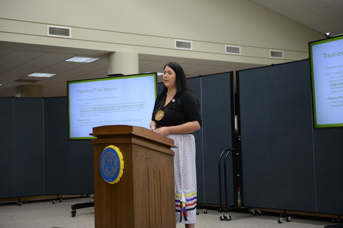 LifeatLSSU's tweet photo. Whitney Gravelle, president of the executive council of the Bay Mills Indian Community (pictured), spoke this afternoon at LSSU activities that marked Indigenous Peoples' Day. Info: https://t.co/QpTGO0bO3e https://t.co/WMkoVzHTdi
