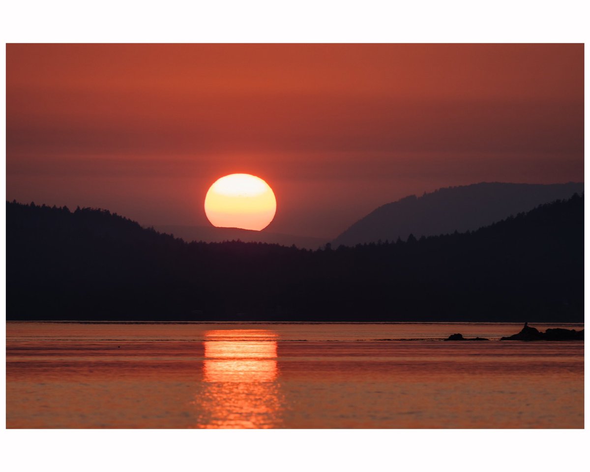 A hazy fall sun sets over the British Columbia’s Southern Gulf Islands.  Layered across the horizon are Saturna, Pender, and Mayne Islands.  

#sunset #Canada #britishcolumbia #photography #NFTCommunity