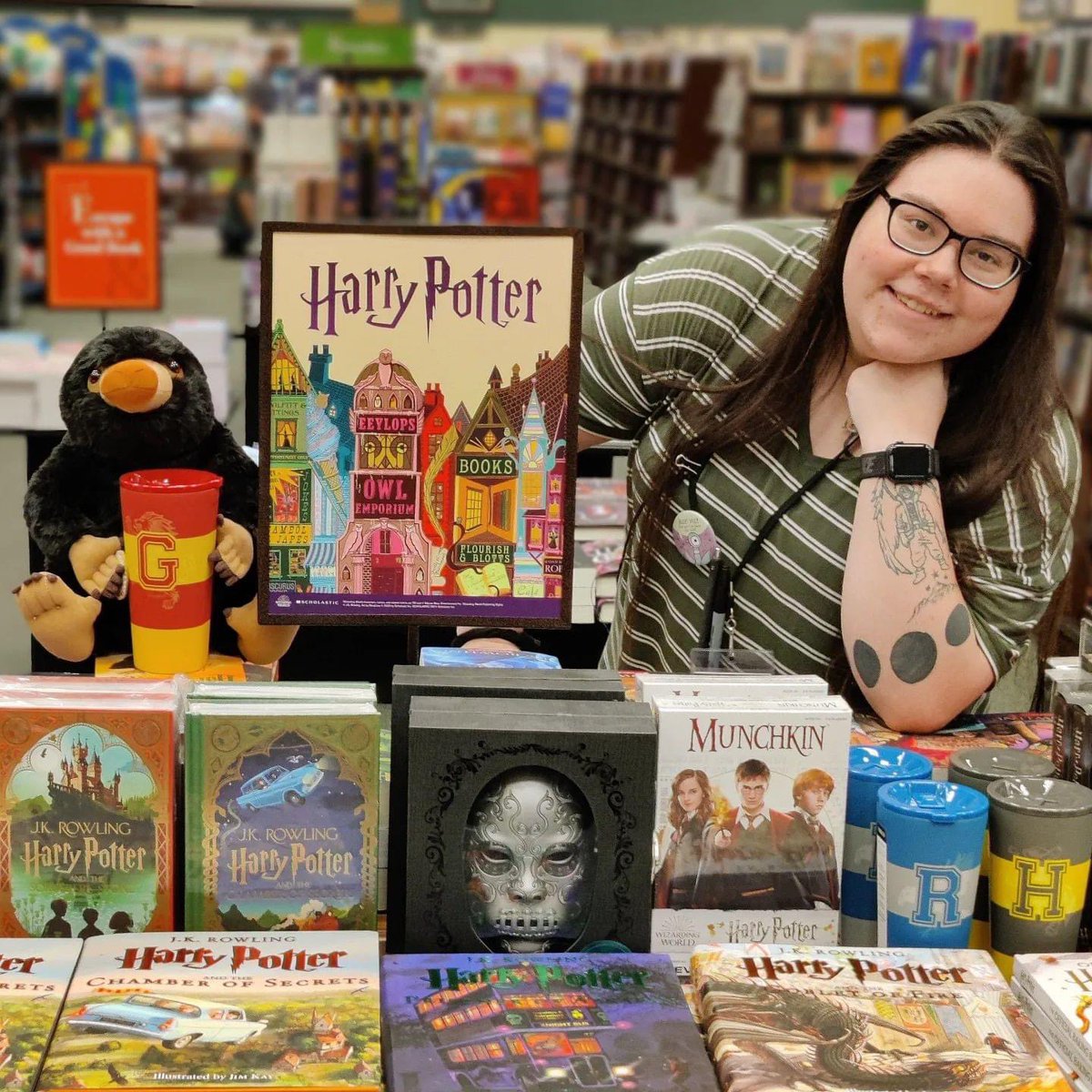 MEaston98's tweet photo. Sometimes you just have to awkwardly pose with books for a social media post for work. #bookseller #booksellerproblems #cringysmiles https://t.co/VIsy8ITXgP