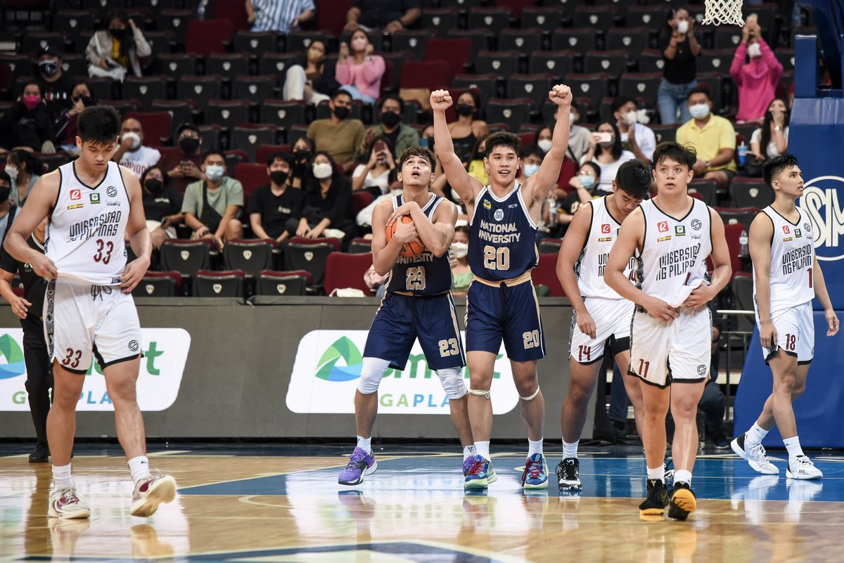 NationalUPhil's tweet photo. Defending champs bowed down to the Bulldogs! 💛💙

More photos here: https://t.co/vJ3Y8GfFnQ

POG: Omar John - 16pts, 9 reb, 2stl &amp; 3 blk (7/15 FG)

📸 UAAP Media Team 

#GalingNU #PusongNationalian #UAAPSeason85 https://t.co/s2nwomlVXG