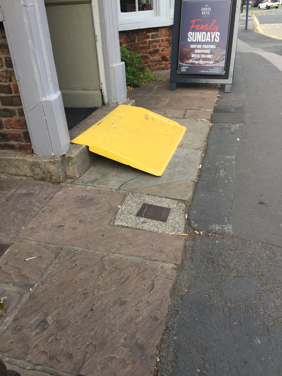 My first sighting… Watched as an older man tried to step over it, couldn’t quite manage it &amp; slipped on it. And that was on the way in to the pub ! Useless for wheelchair users as impossibly steep gradient owing to height of step. A trip hazard for everyone else.
NOT ACCESS.