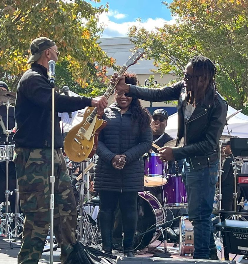 Ali receives a brand new Gibson Les Paul Goldtop from Concerts for Causes Inc. At Savor Bowie Fall Fest 2022, An amazing young man with an amzing instrument. Thank You Myka Miller and Guitar Center Foundation.