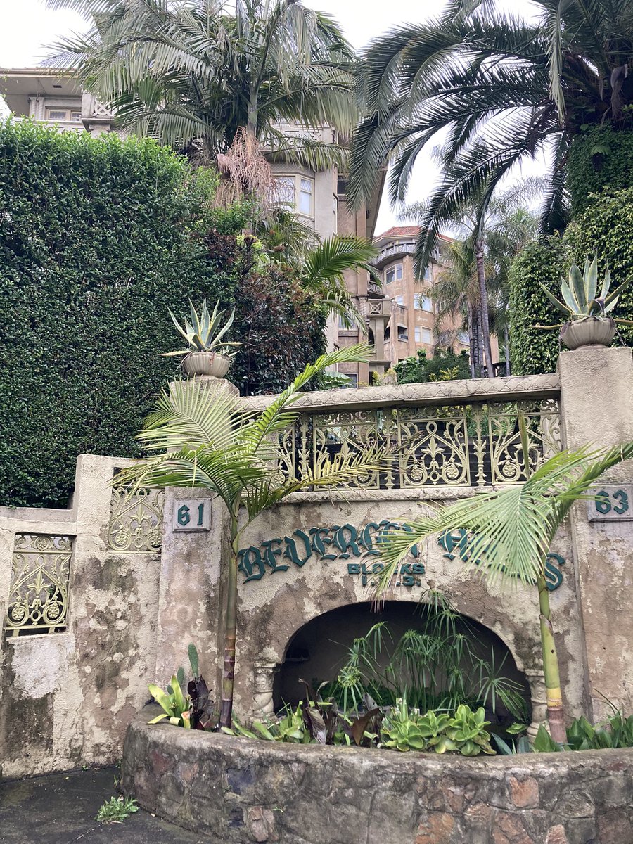 HeyerSociety's tweet photo. This quirky (gorgeous!) period apartment complex in Melbourne makes me think of Heyer’s mysteries — can’t you just see the Vereker siblings living here, just being rude to everyone? https://t.co/NVdgdzTNNT