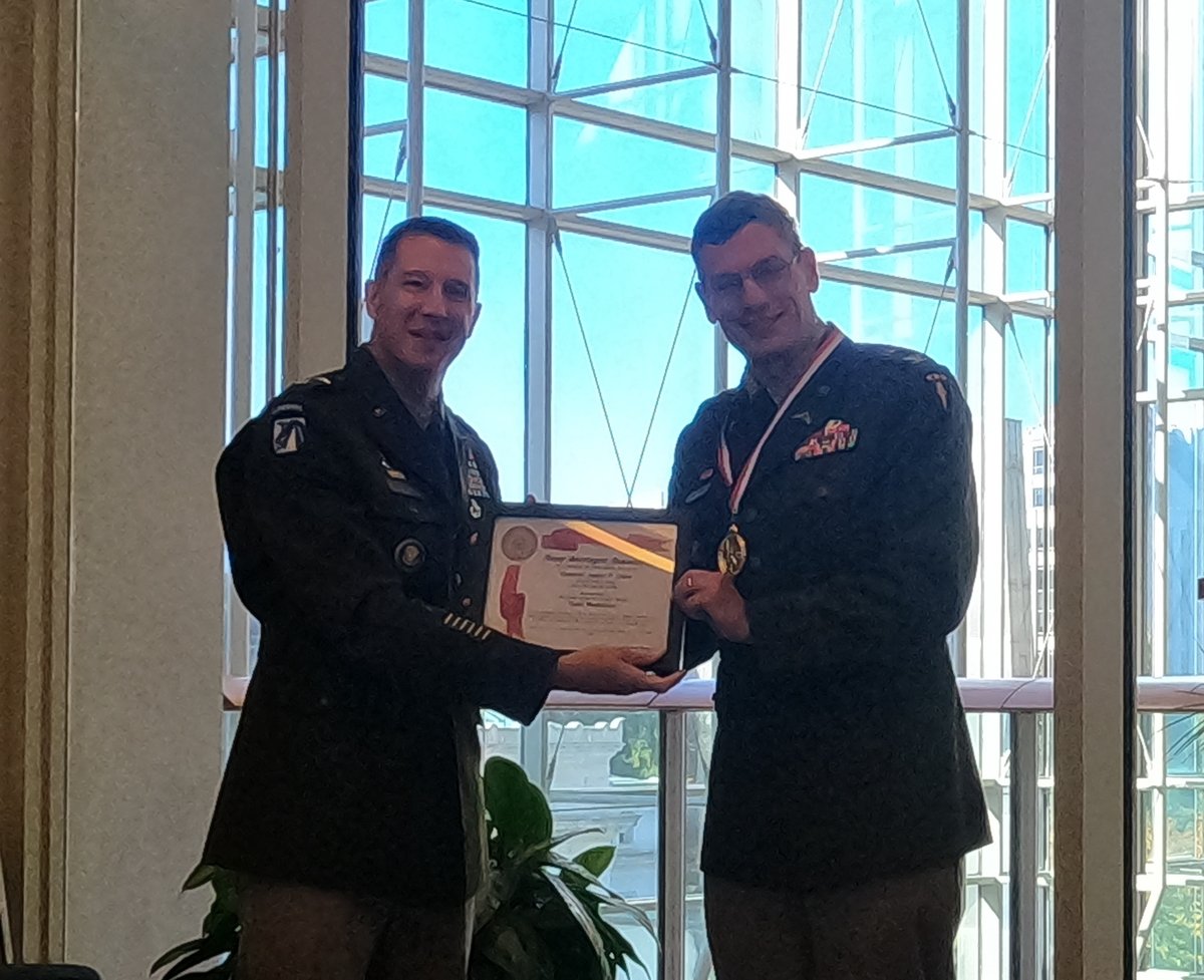 ArmyStrategist's tweet photo. Congratulations to Army Strategist J.P. Clark for winning the Order of Saint Gabriel GOLD for 2022. The highest award for an Army Strategist. MG Charles Miller presented the award to J.P. at the ASA Awards Breakfast during AUSA Annual Meeting. #strategy https://t.co/s2UhXGED32