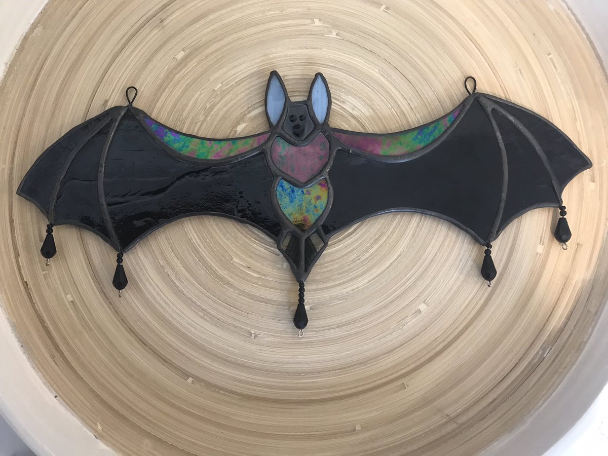 moreton_ian's tweet photo. Customer order for a black bat, so I added some sparkly accents and changed the beads to black #bat #stainedglass #crafter #handmade #glassbat #suncatcher #mooncatcher #Halloween https://t.co/3jUUGr9l8Y