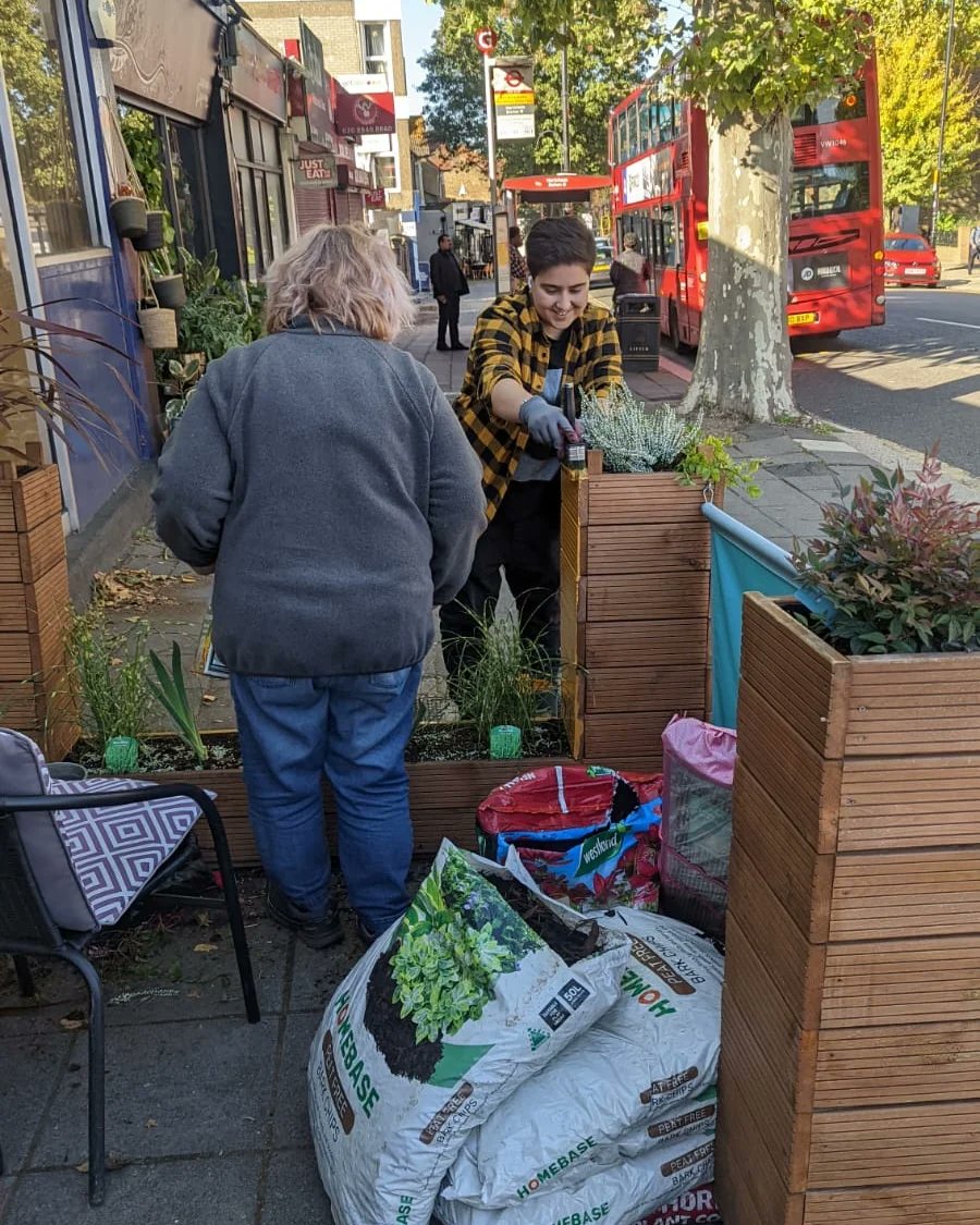 ElementCoffeeUK's tweet photo. Just a couple of gals working their little tushies off to update our planters for winter ✨💚 thank you to Nat and her mum for an amazing facelift! Have you seen them yet? We've developed a particular love for the zebra grass 🦓 #northfields https://t.co/fKq514QTsW
