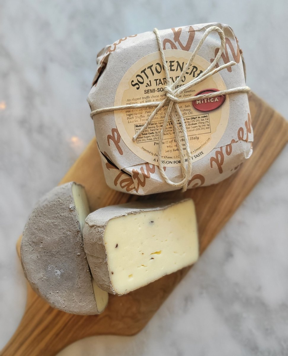 🧀 Sottocenere al Tartufo comes from the northern Italian region of Veneto where black truffles are added into the paste of the cheese - then it is aged in a coat of nutmeg, coriander, cinnamon, licorice, cloves &amp; fennel. The result? A semi-soft cheese both delicate + aromatic.