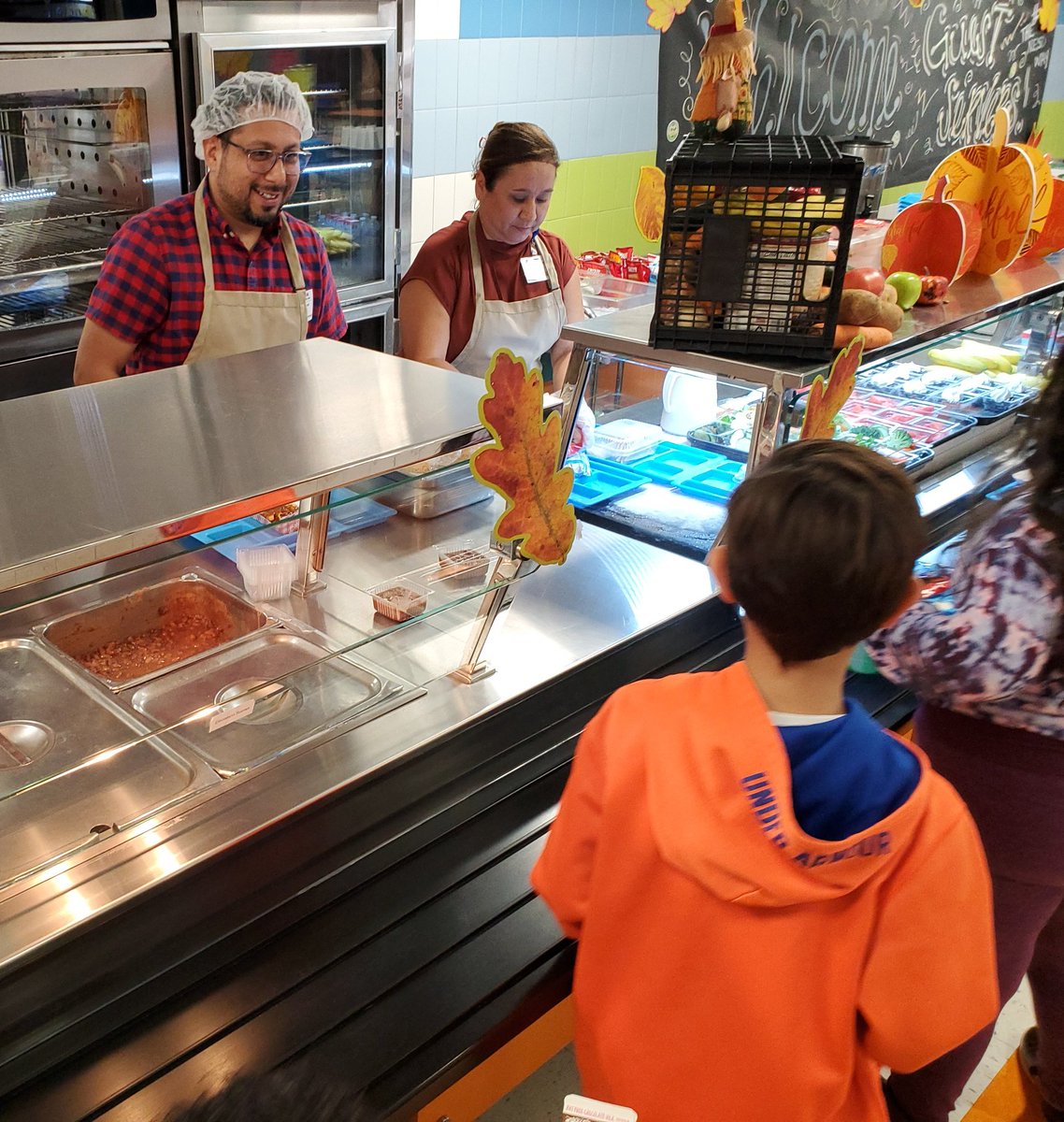 olenickcaldwell's tweet photo. @NEISD is celebrating National School Lunch Week with guest servers, including @DiegoBernalTX, @sandyjwh, @dr_maika and @sgrona who were on the line serving nutritional school lunches. It smells good in here! #RootEdColonialHills https://t.co/jUESyDDdE9