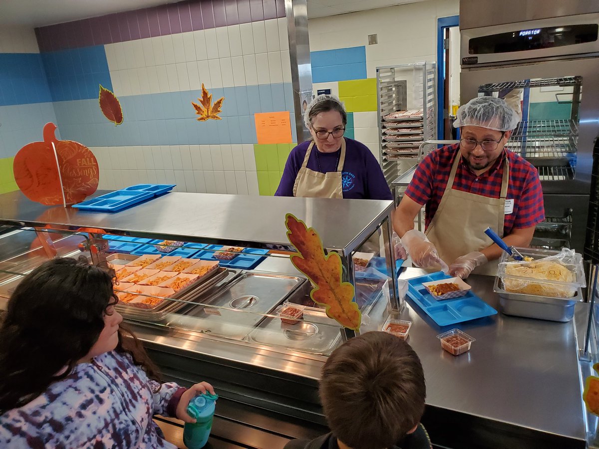 olenickcaldwell's tweet photo. @NEISD is celebrating National School Lunch Week with guest servers, including @DiegoBernalTX, @sandyjwh, @dr_maika and @sgrona who were on the line serving nutritional school lunches. It smells good in here! #RootEdColonialHills https://t.co/jUESyDDdE9